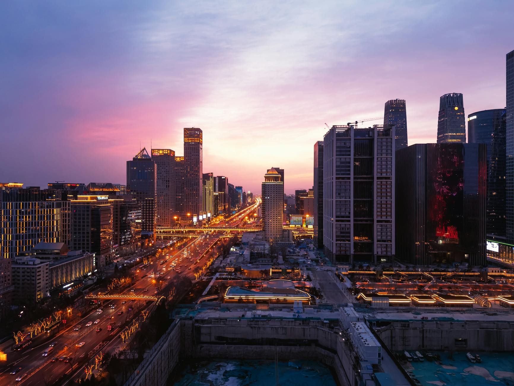Beijing skyline with modern hotels and traditional architecture at sunset