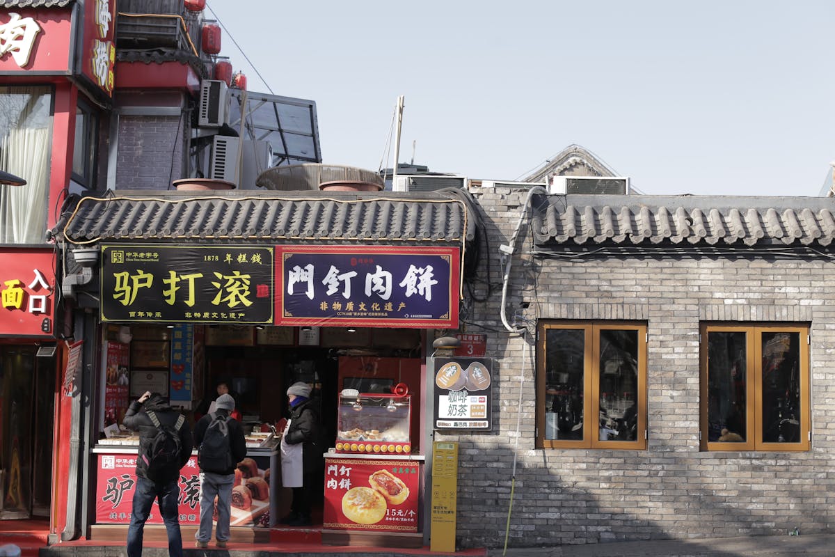 Beijing street food stall with Chinese snacks in a busy market