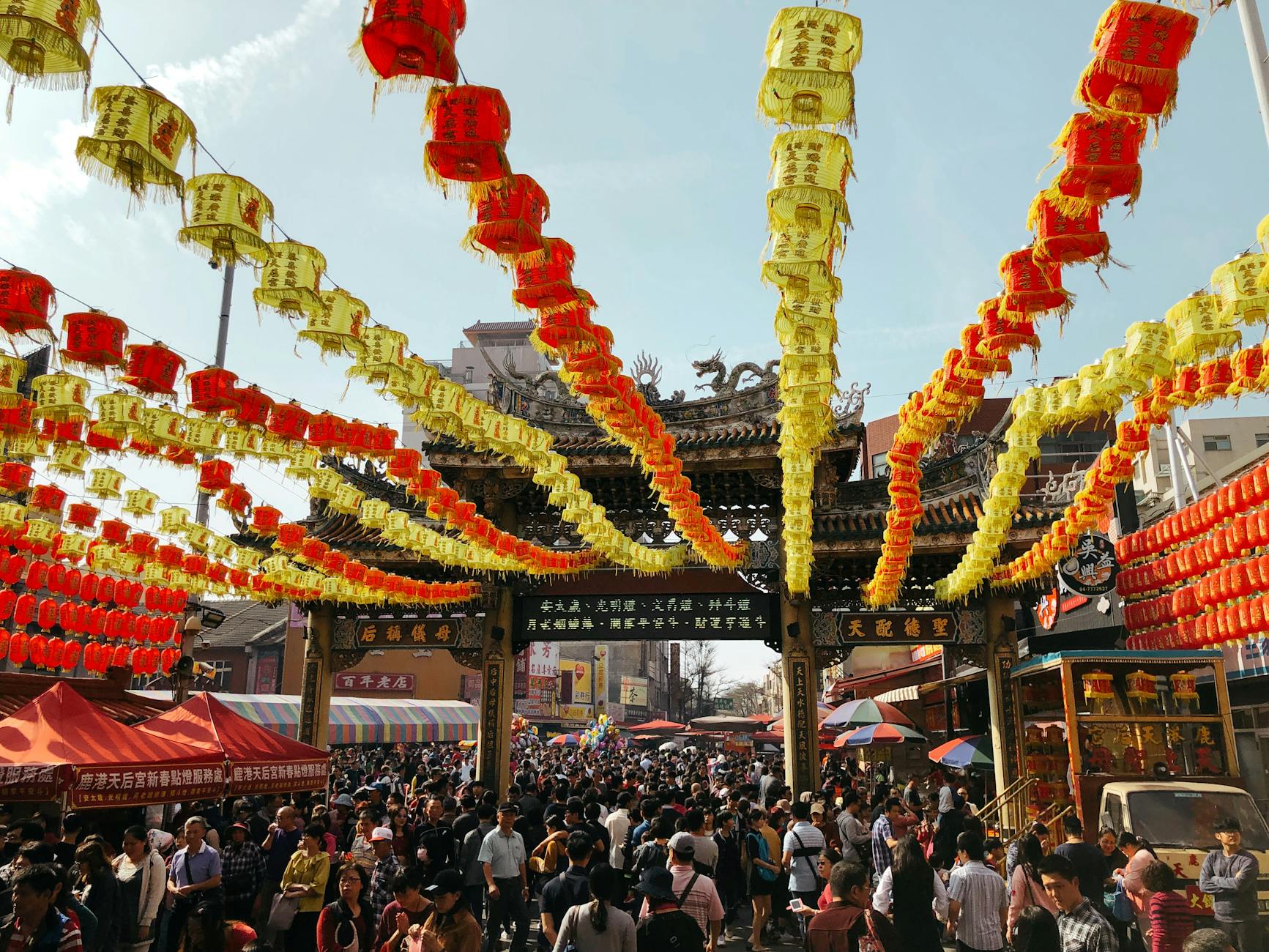 Traditional Beijing temple fair with crowds and market stalls