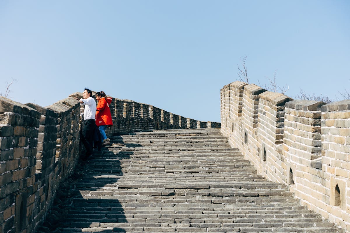 Tourists exploring the Great Wall of China near Beijing on a sunny day