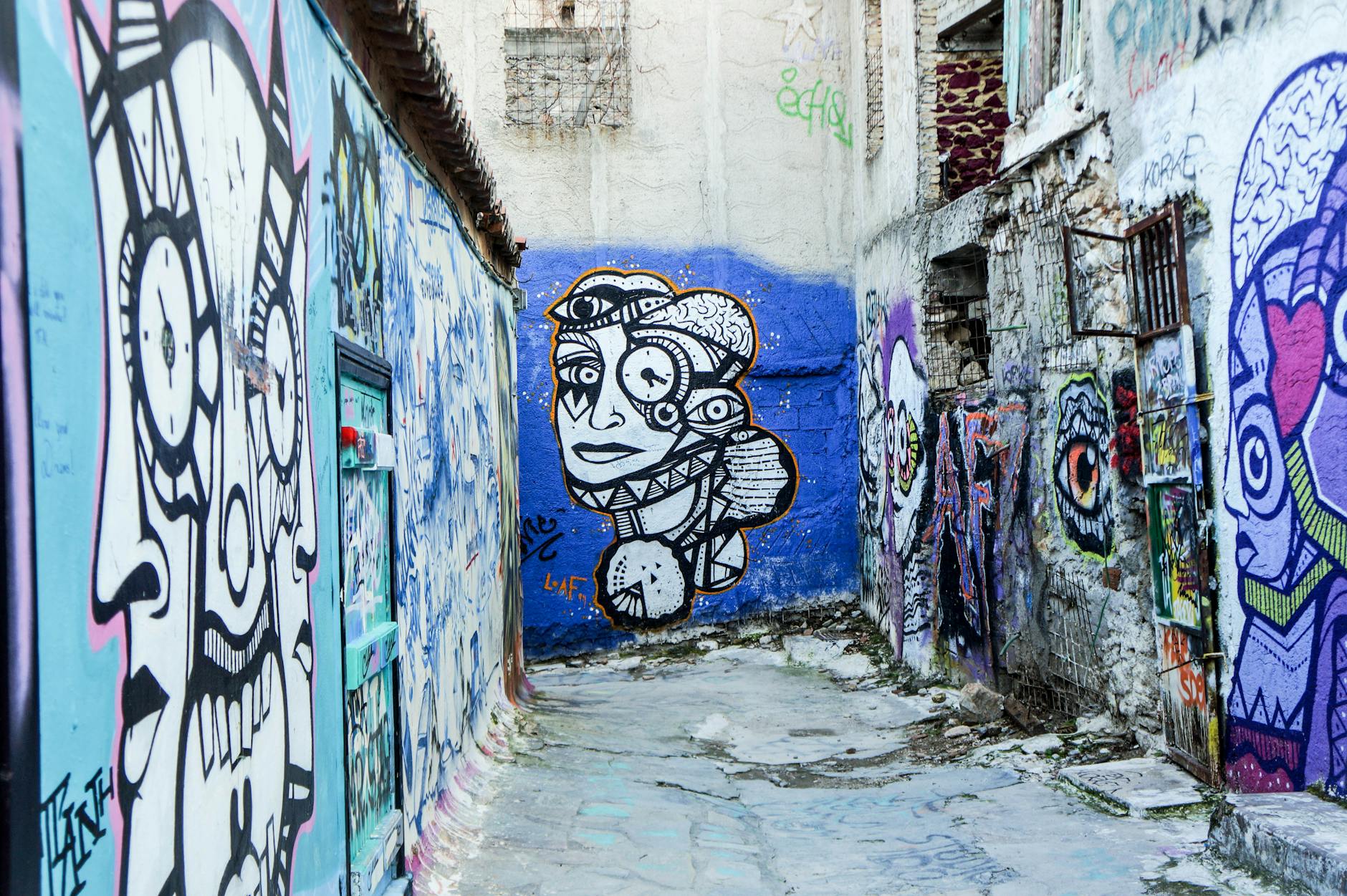 Colourful graffiti and street art in a narrow alley