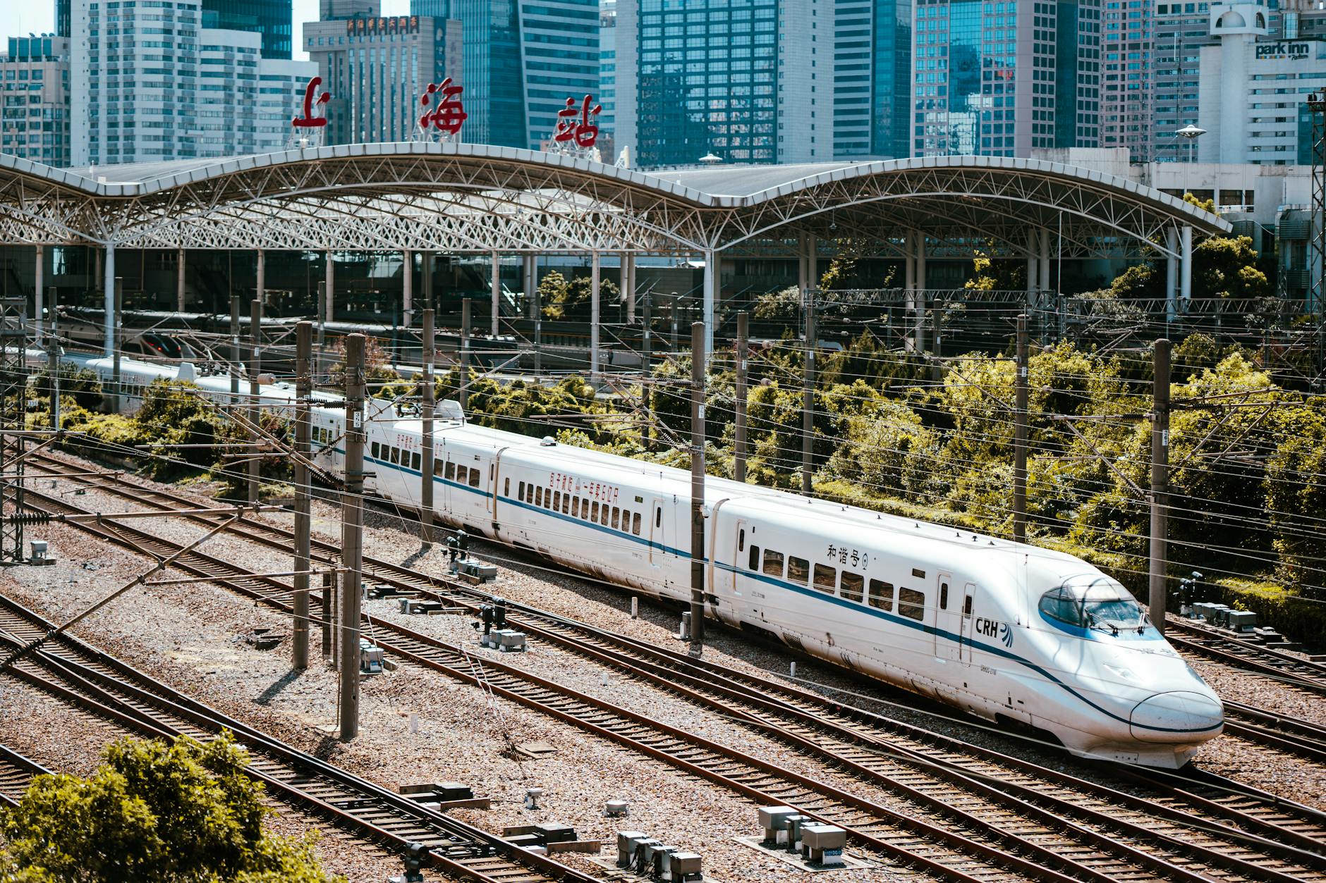 A high-speed train passing through a Chinese railway station