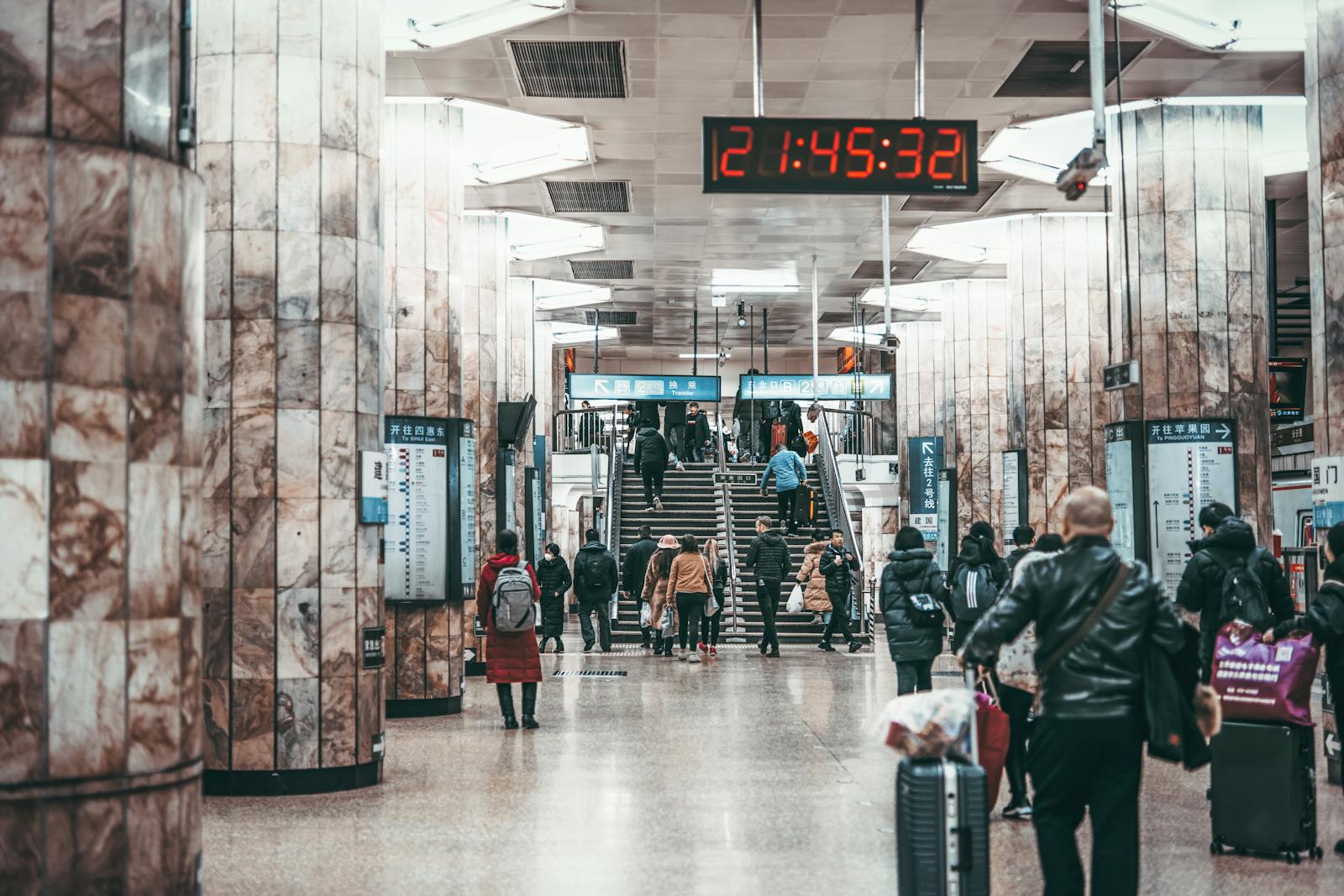 Beijing subway station commuters at night