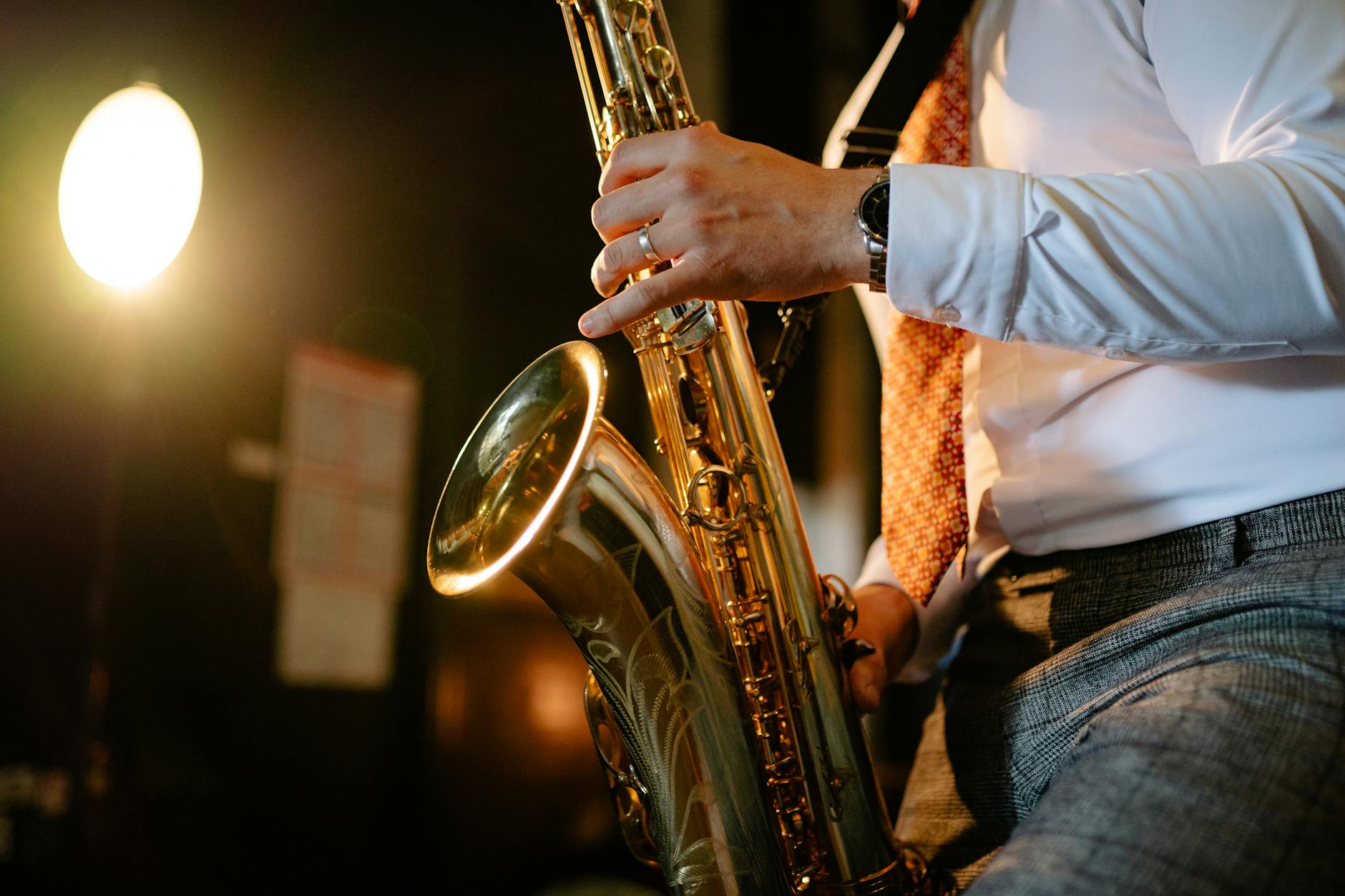 Close-up of a saxophonist performing in a club