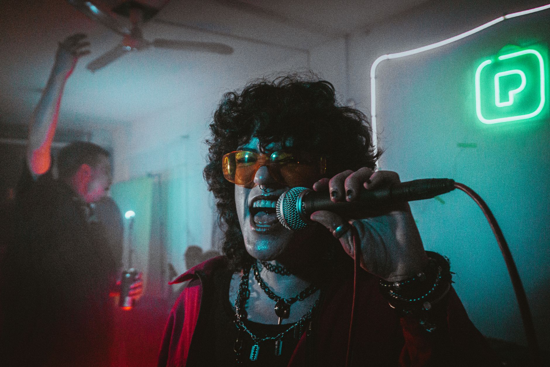 A dynamic karaoke performance at a lively venue
