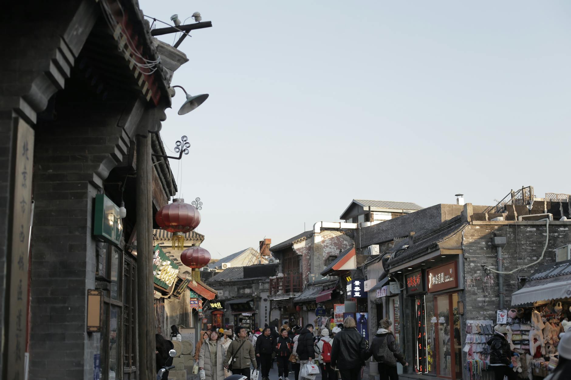 Busy market street in a historic Beijing hutong