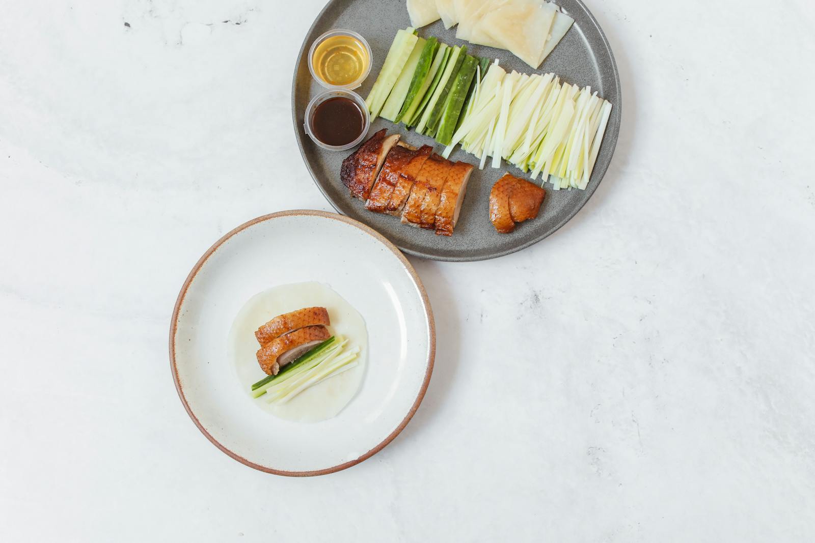 Peking duck served with cucumbers scallions and pancakes Beijing
