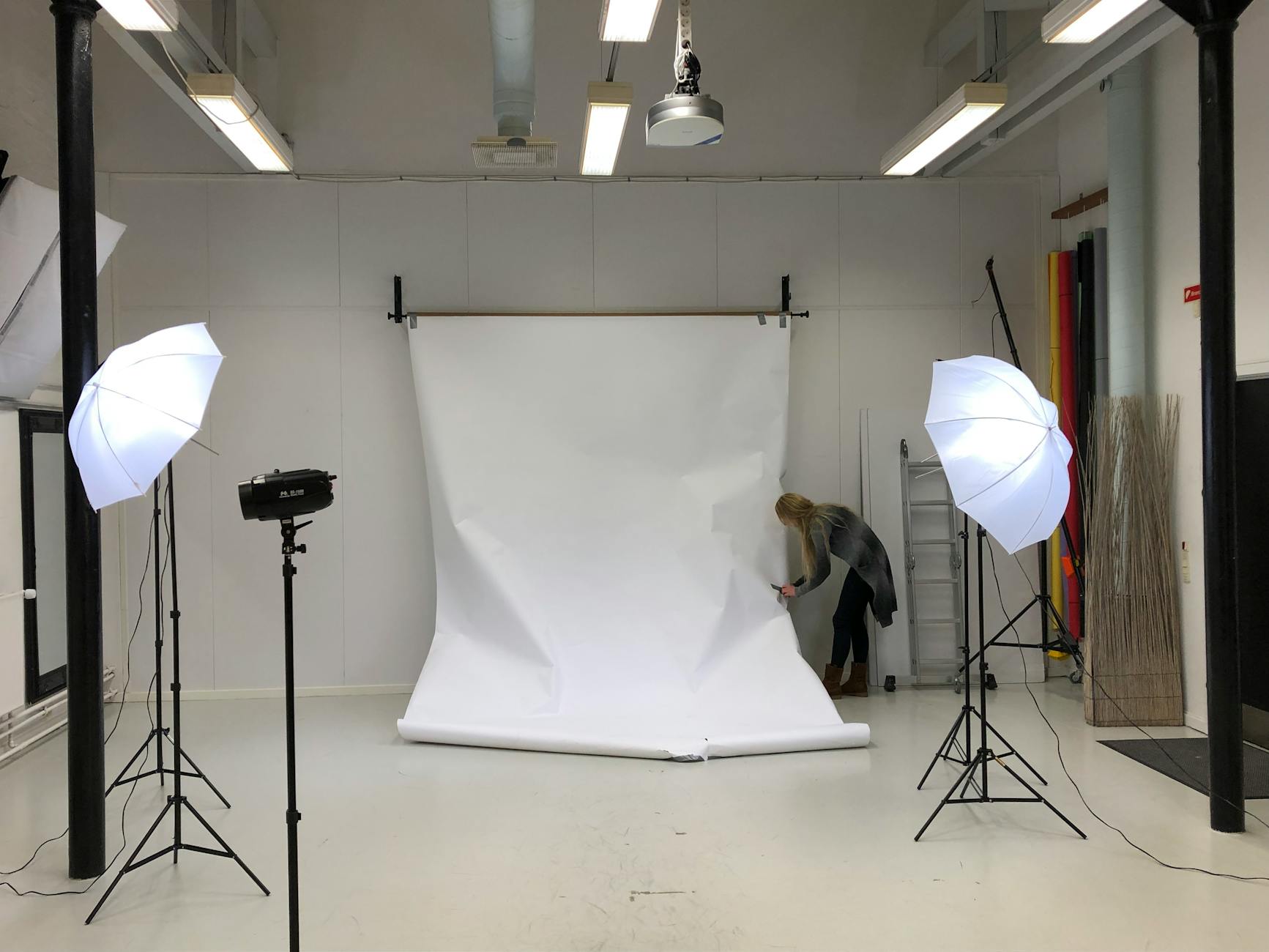 Photo studio with white backdrop set up for China visa photo requirements compliance