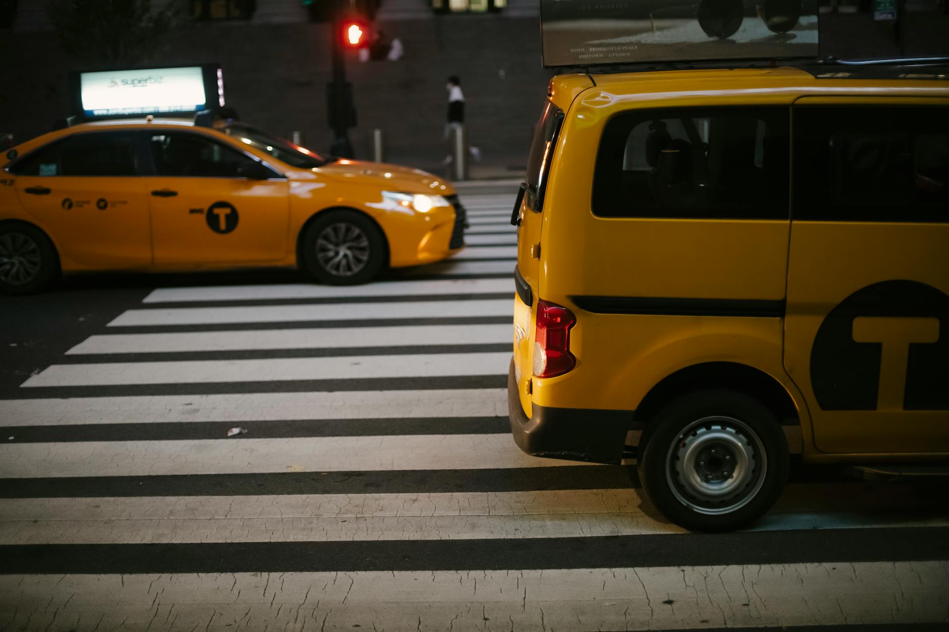 Beijing taxi cab driving down a Beijing street with iconic city architecture