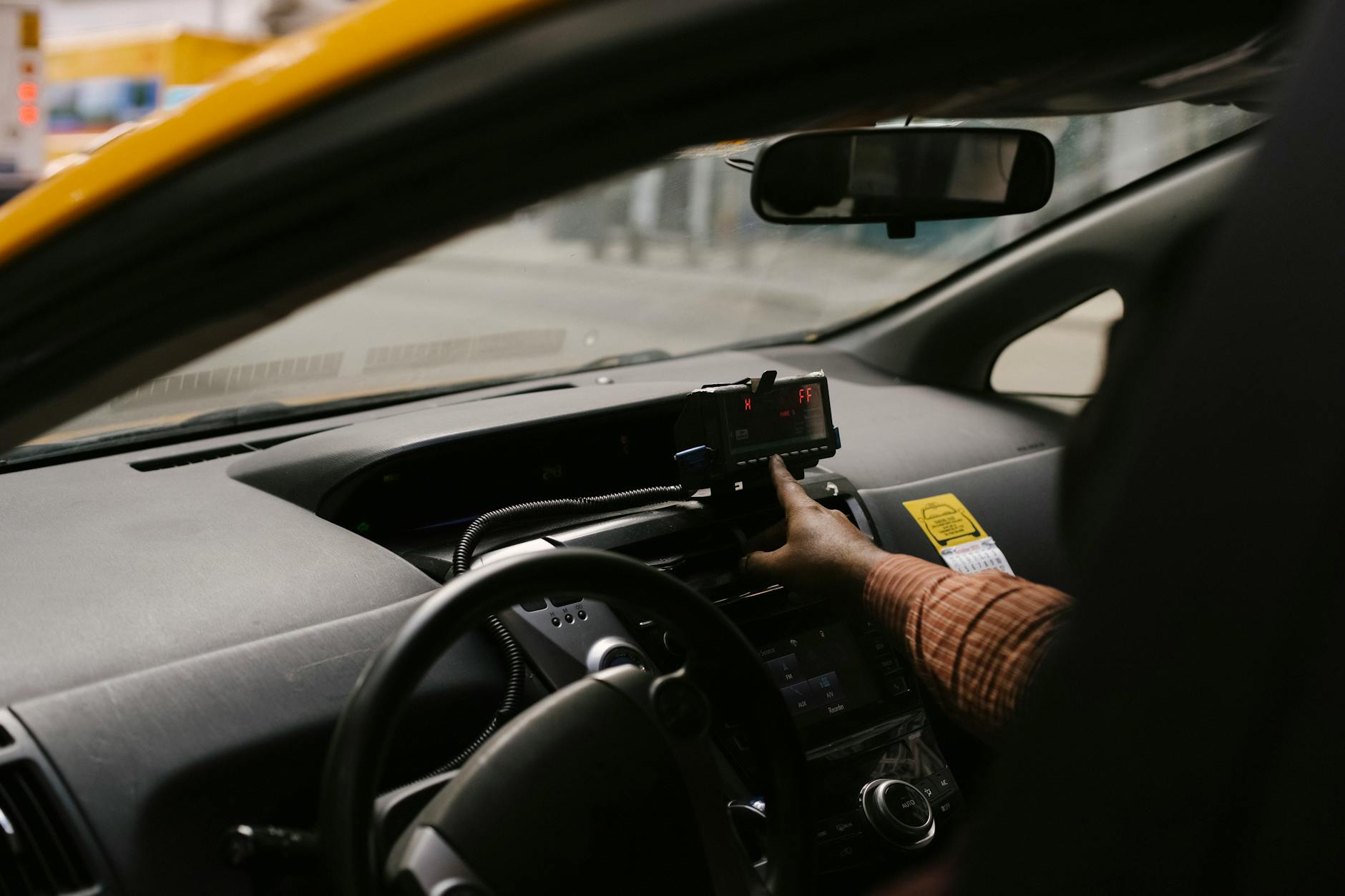 Beijing taxi meter and dashboard with fare display visible to passenger