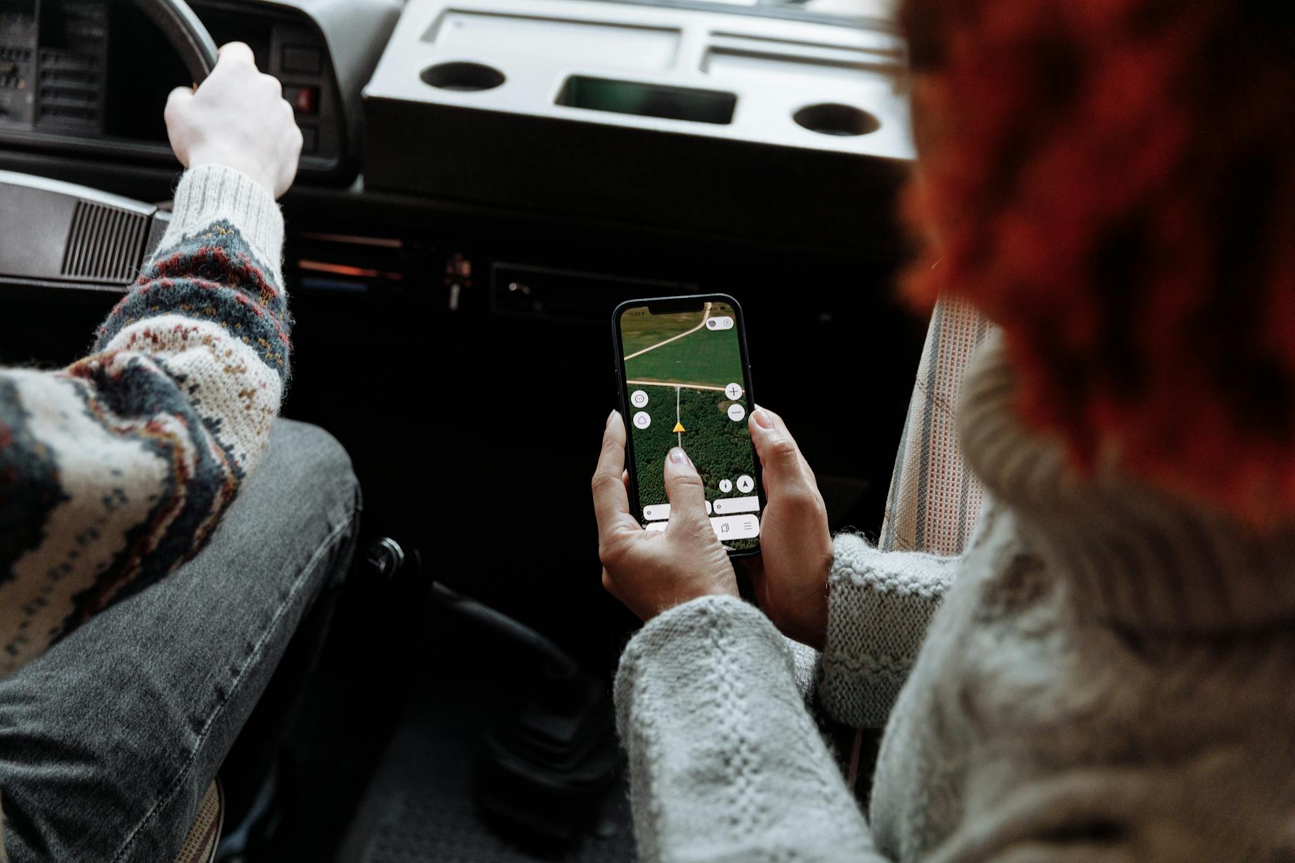 Smartphone showing a navigation app with bus route directions in Beijing