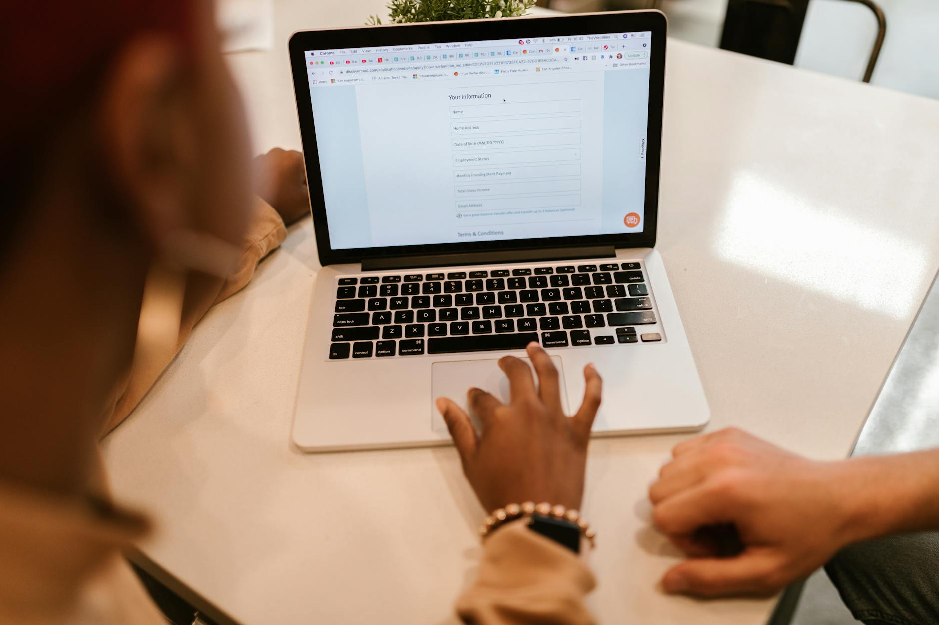 Filling out the China Online Visa Application form on a laptop