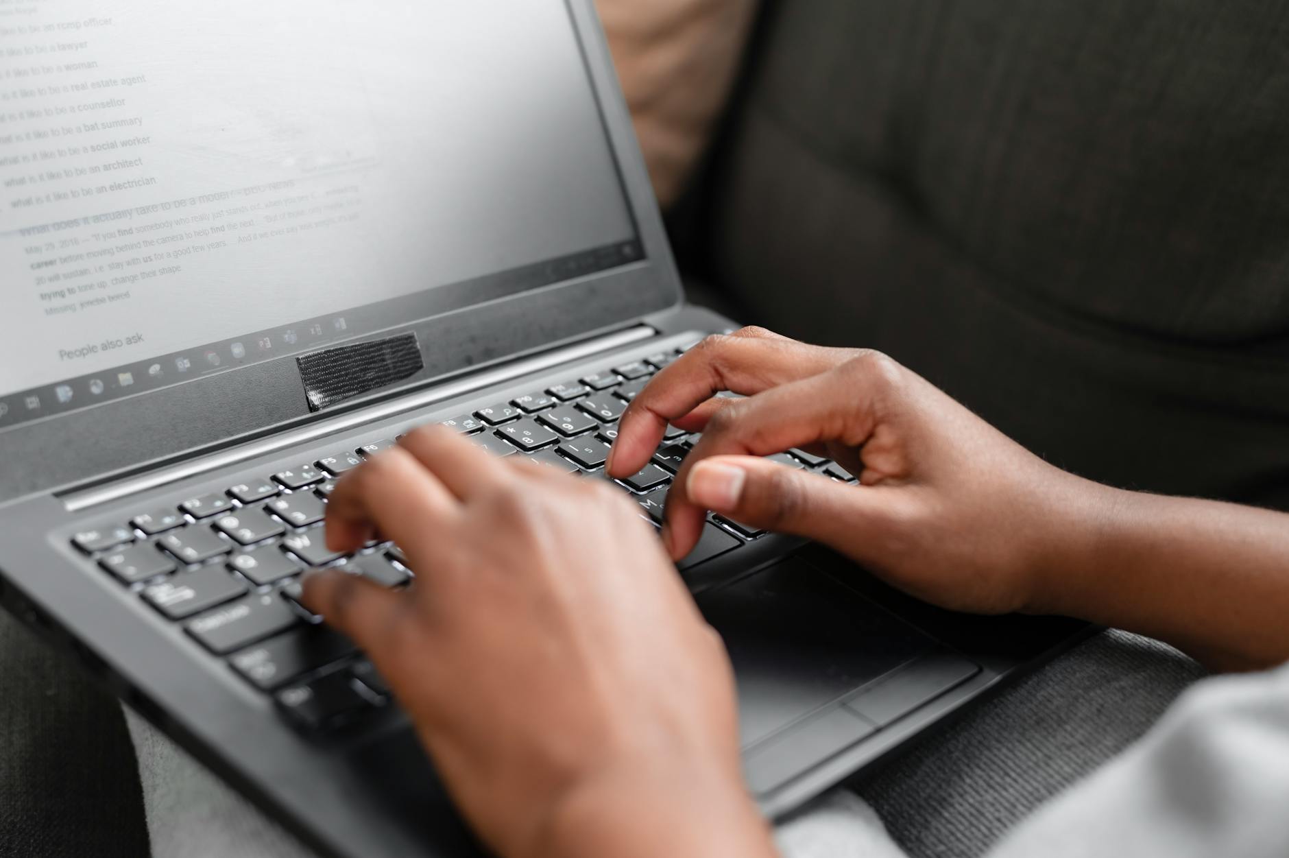 Person using laptop at home to complete the New COVA China e-visa application