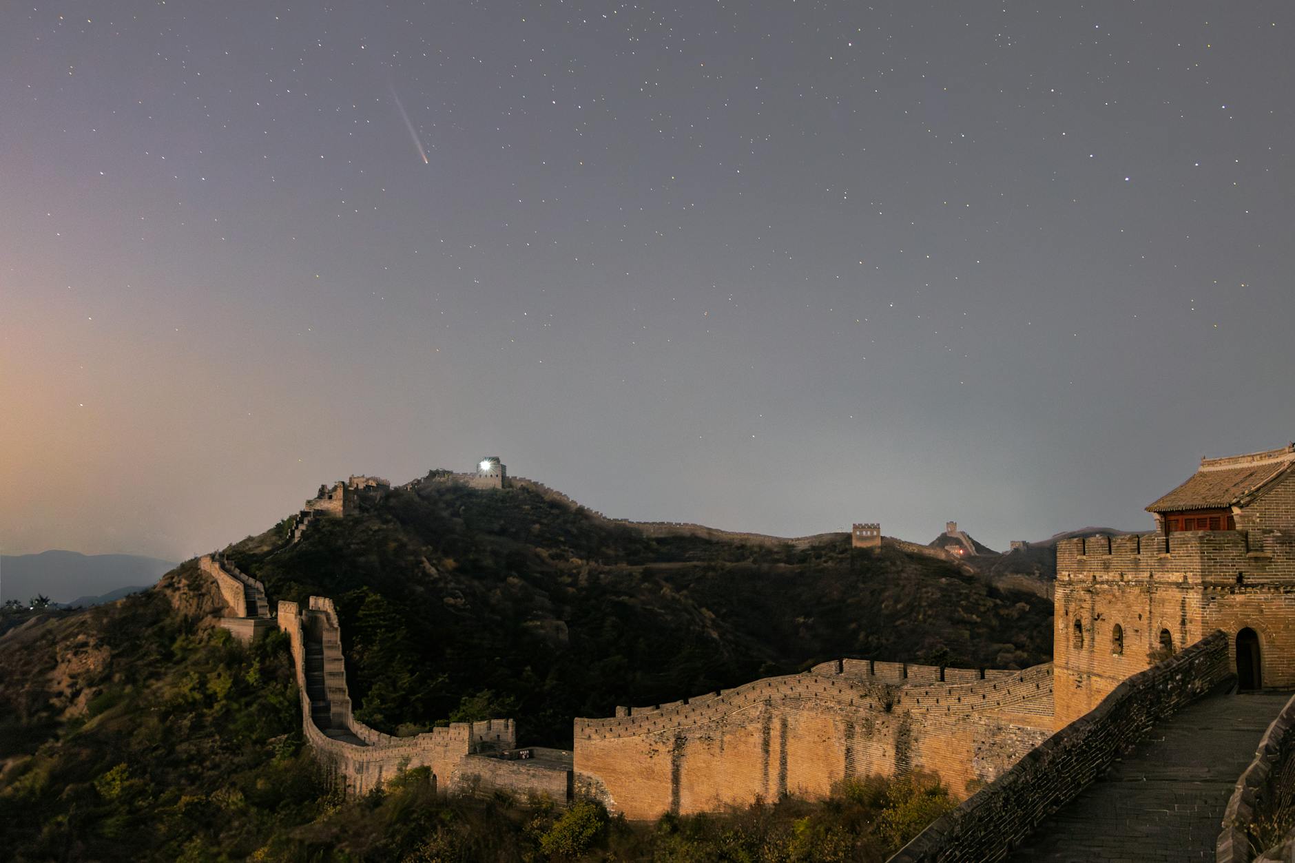 The Great Wall of China under a starry night sky