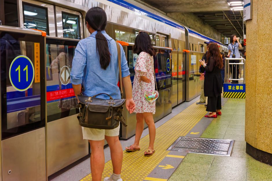 Commuters waiting on a Beijing subway platform