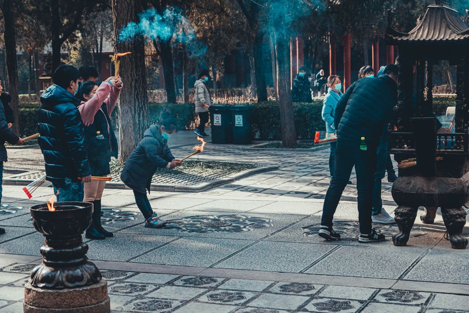 Incense smoke rising at a traditional Beijing temple courtyard