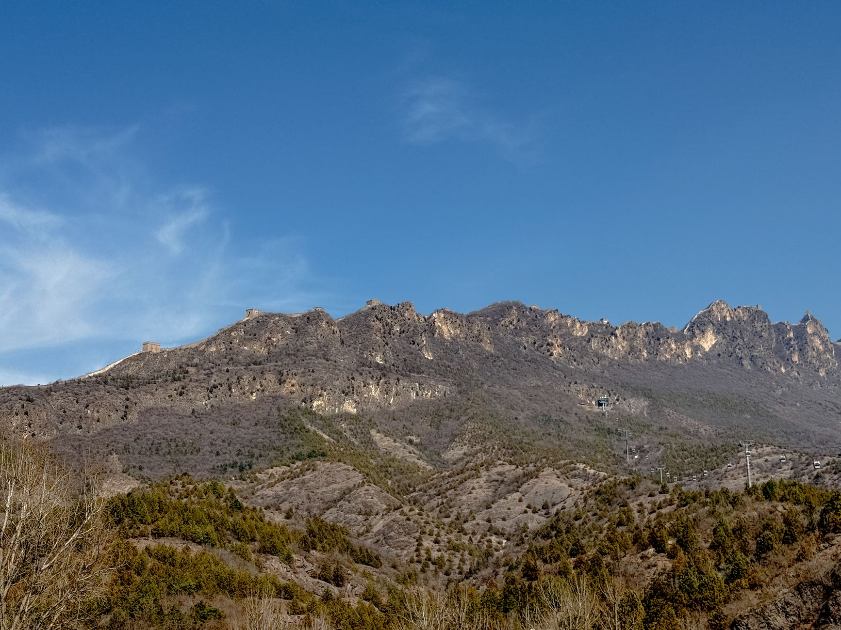 Hikers on the Great Wall of China mountain trail near Beijing