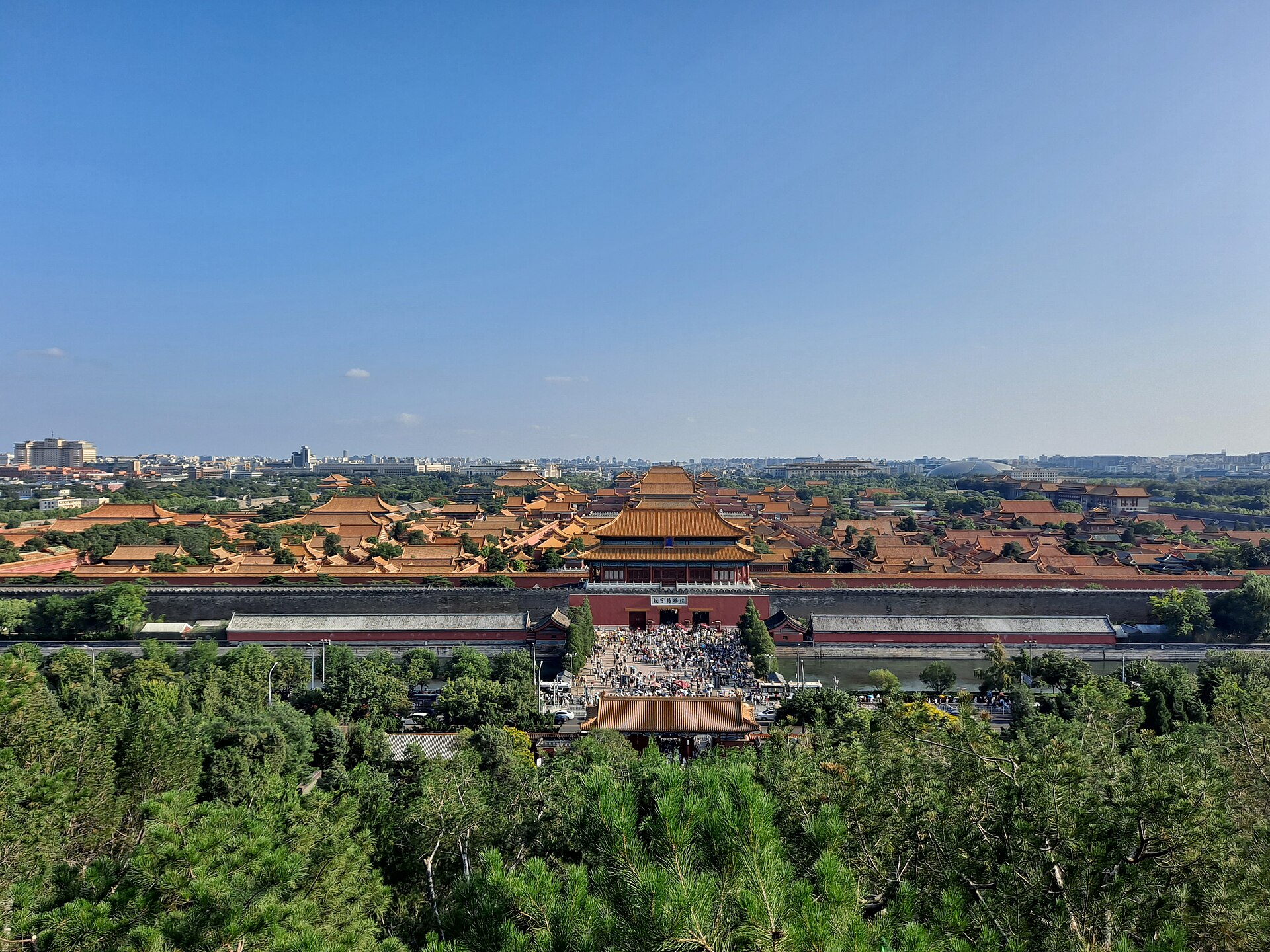 The Forbidden City seen from Jingshan Park, its gold roofs receding in ranks towards the Beijing skyline